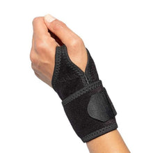 Load image into Gallery viewer, Compression Wrist Wrap on left hand.